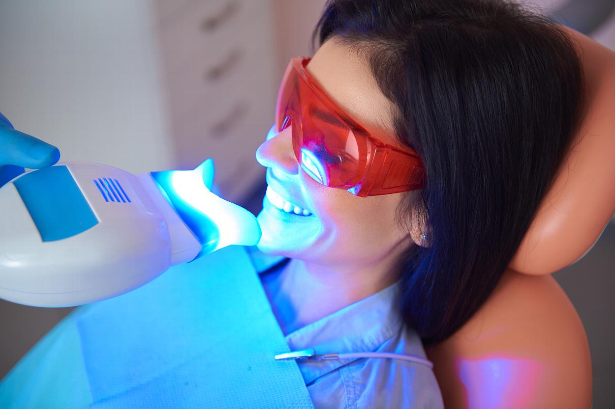 Woman having her teeth whitened